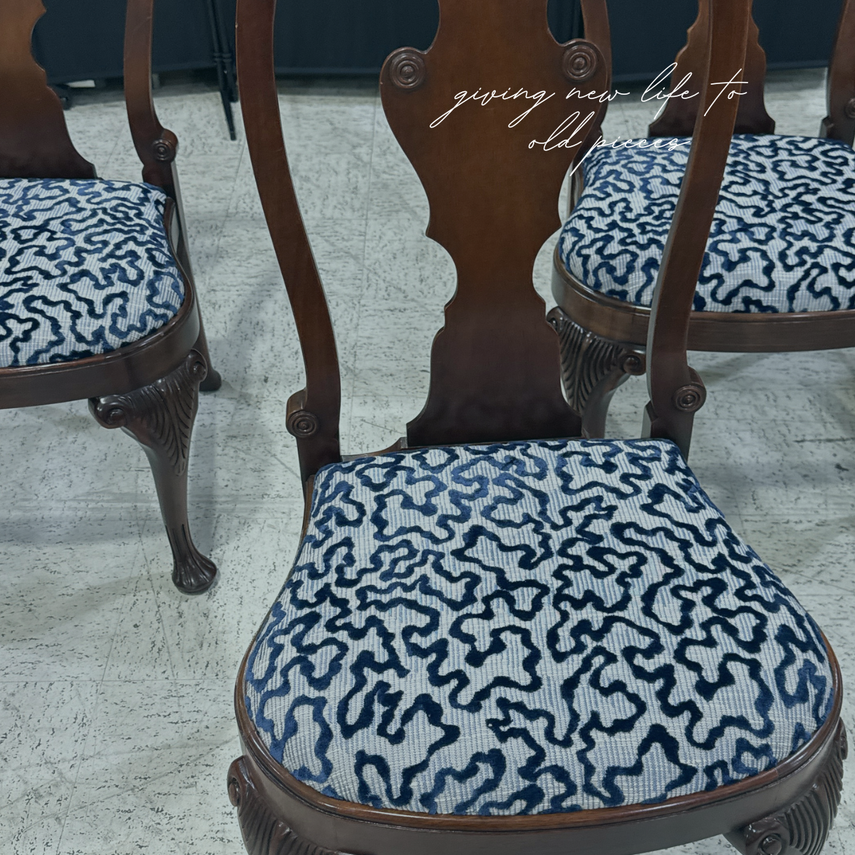 Vintage dining chairs reupholstered in a blue patterned fabric